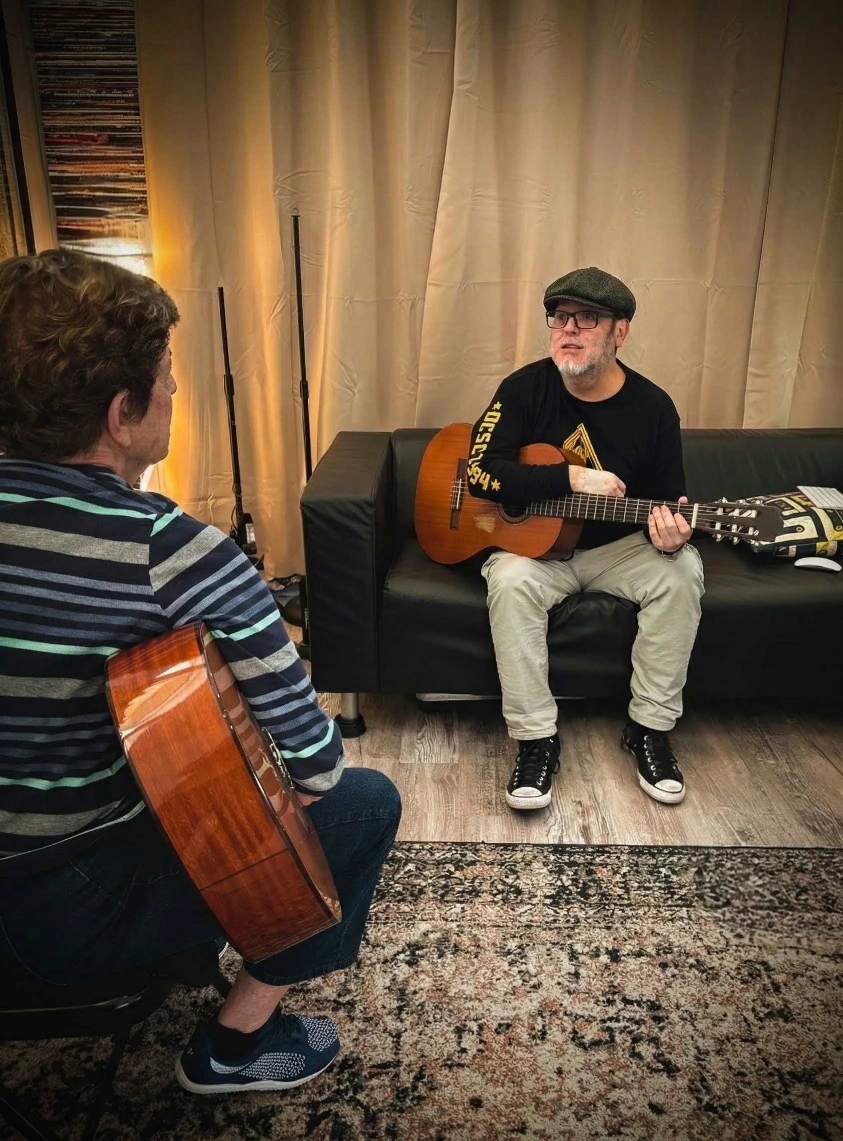 Senior student receiving a relaxed, one-on-one guitar lesson at PlayPro Guitar School in La Mesa