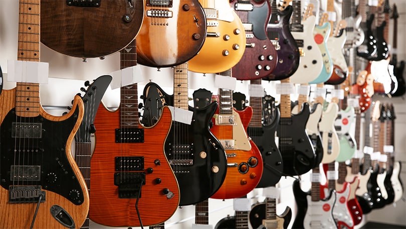 Variety of electric and acoustic guitars for beginner guitar lessons at PlayPro Guitar School La Mesa