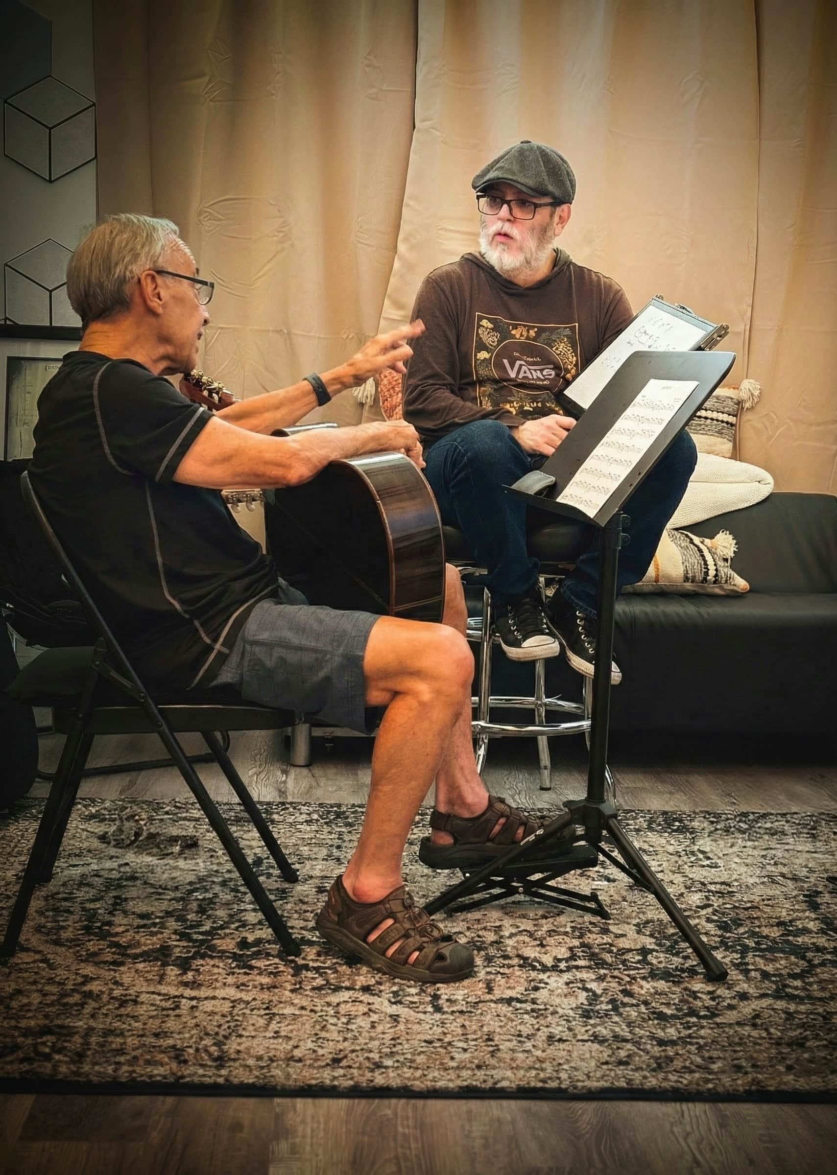 Senior guitar student learning with clear guidance from an instructor at PlayPro Guitar School in La Mesa