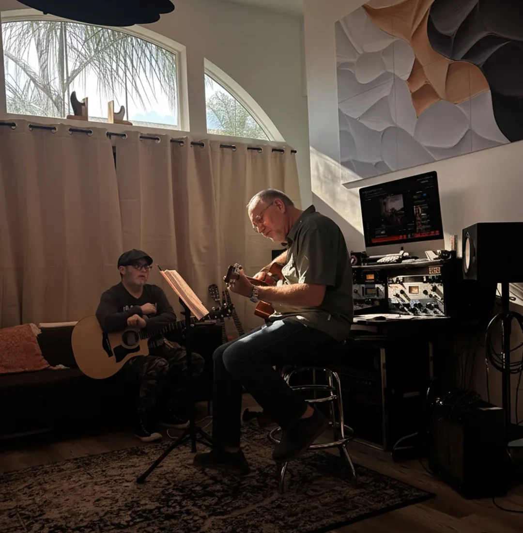 Guitar teacher coaching a student during a one on one guitar lesson inside a La Mesa California music studio